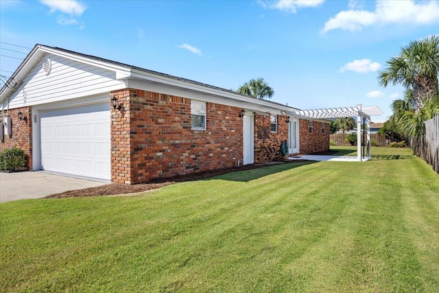 exterior space featuring a yard, a pergola, and a garage