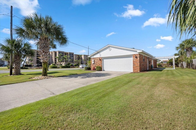 view of front of house featuring a garage, a pergola, and a front yard