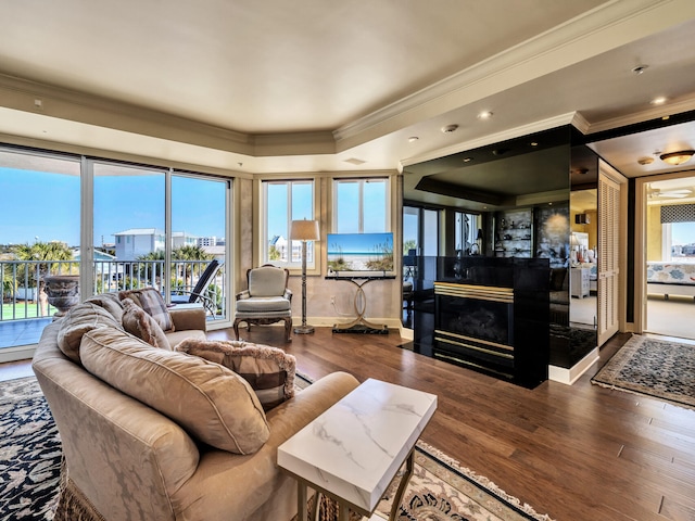 living room with hardwood / wood-style floors and ornamental molding