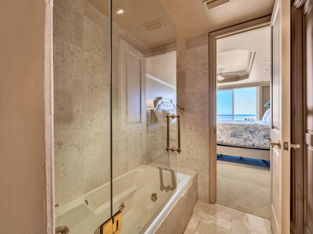 bathroom featuring tiled shower / bath