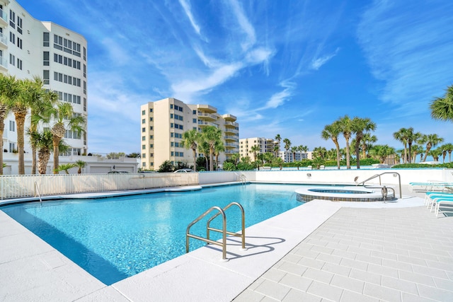 view of swimming pool with a community hot tub and a patio