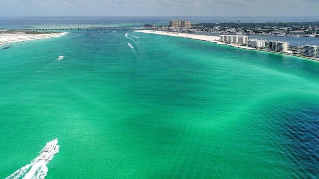 bird's eye view featuring a water view and a beach view