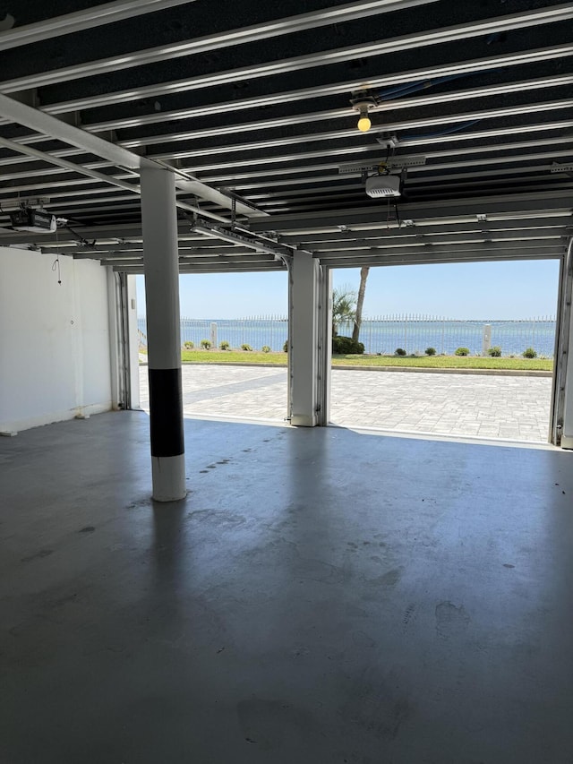 garage featuring a water view and a garage door opener