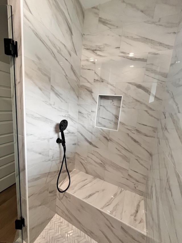 bathroom with a shower stall