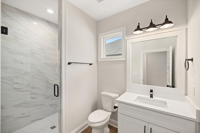 full bathroom with toilet, recessed lighting, a marble finish shower, baseboards, and vanity