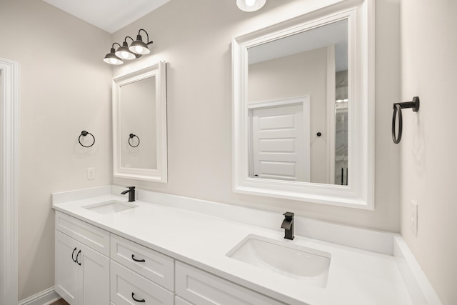 bathroom featuring a sink and double vanity