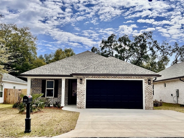 ranch-style home featuring brick siding, concrete driveway, a shingled roof, and a garage