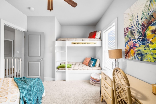 bedroom featuring ceiling fan and carpet