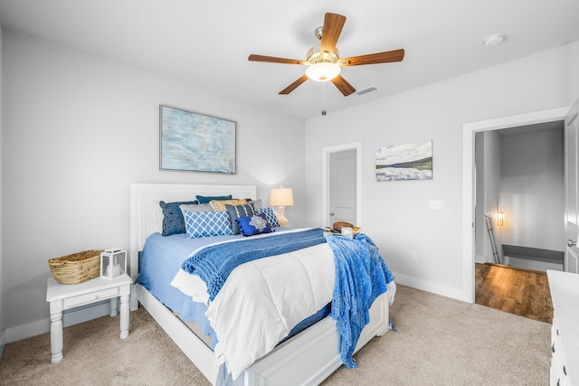 carpeted bedroom with ceiling fan