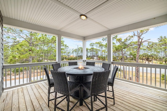 deck featuring an outdoor fire pit