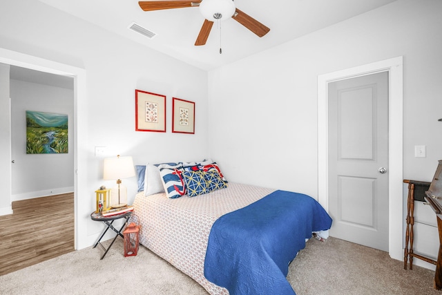 bedroom featuring ceiling fan and carpet