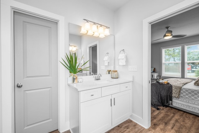 bathroom featuring hardwood / wood-style flooring, vanity, and ceiling fan