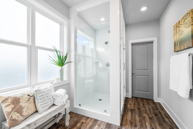 bathroom featuring hardwood / wood-style floors and an enclosed shower