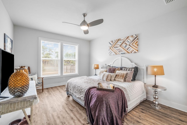 bedroom featuring hardwood / wood-style flooring and ceiling fan