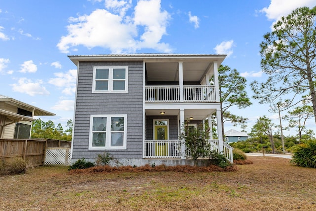 view of front of home featuring a balcony and covered porch