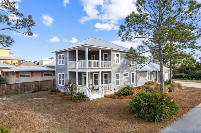 view of front facade featuring a porch and a balcony