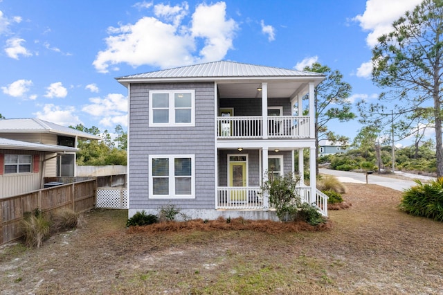 view of front of house with a porch and a balcony