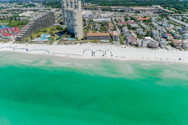 drone / aerial view featuring a view of the beach and a water view