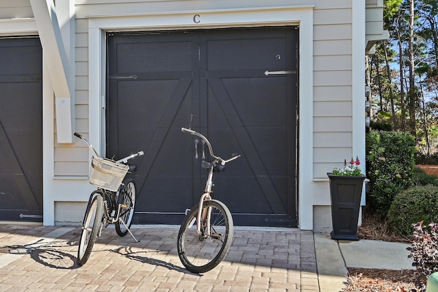 doorway to property with a garage