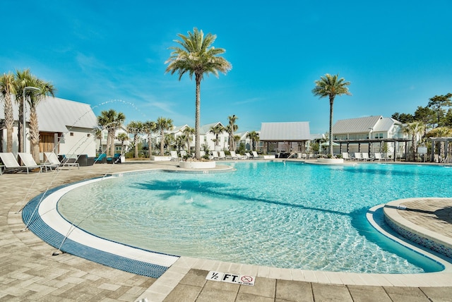 community pool with a patio area