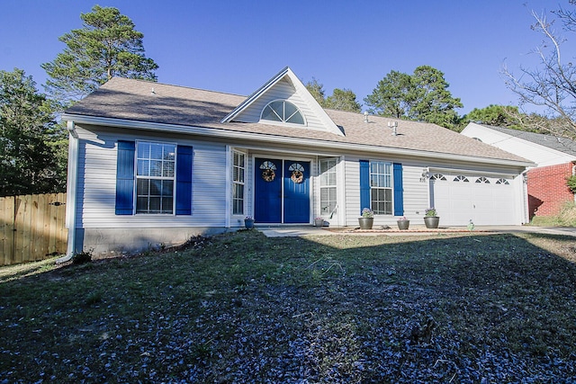 ranch-style home featuring a garage and a front lawn