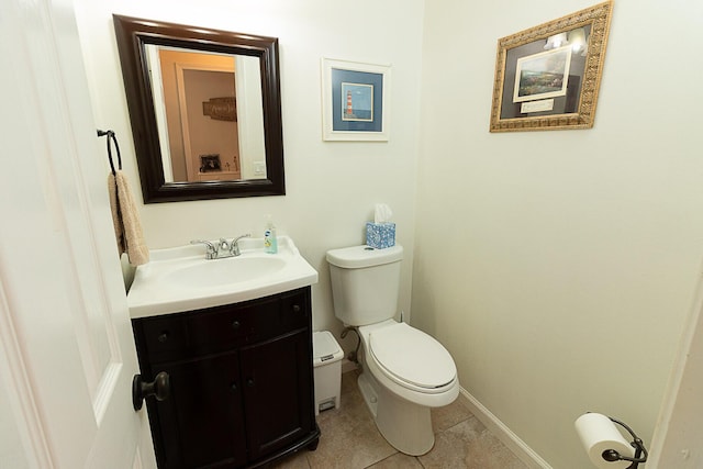 bathroom featuring tile patterned floors, toilet, and vanity