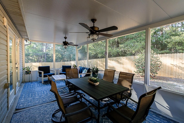 sunroom / solarium with ceiling fan