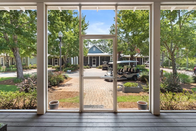 doorway to outside featuring wood-type flooring