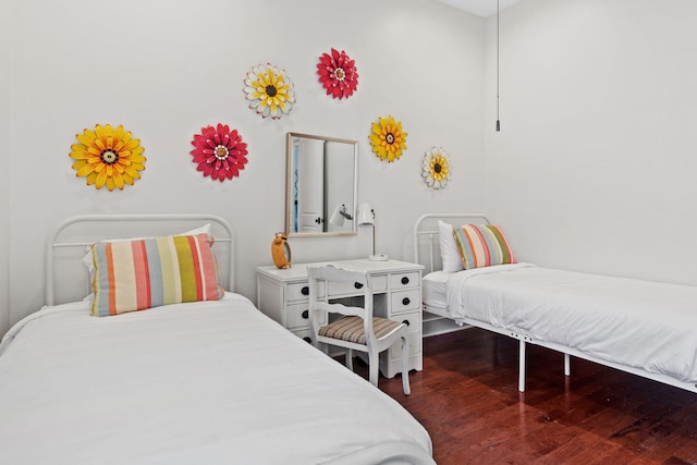 bedroom with dark wood-type flooring