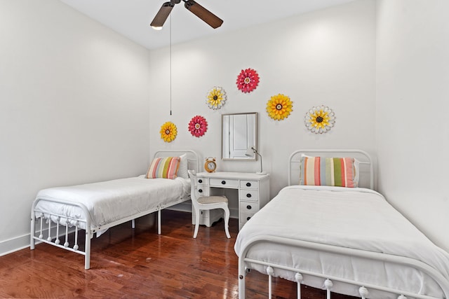 bedroom with dark wood-type flooring and ceiling fan