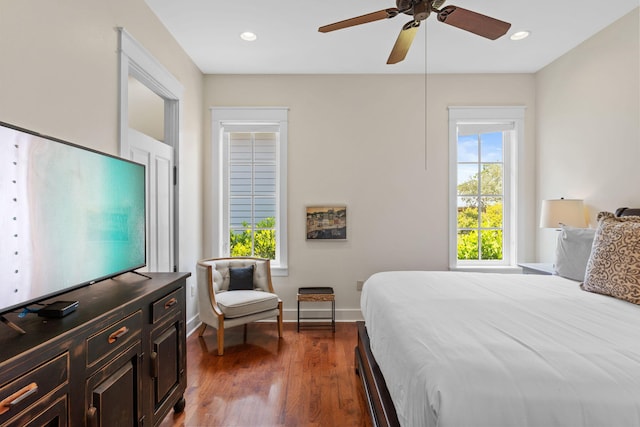 bedroom featuring dark hardwood / wood-style floors and ceiling fan