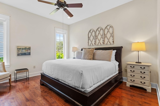 bedroom featuring ceiling fan and dark hardwood / wood-style flooring