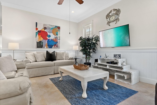 living room with crown molding and ceiling fan