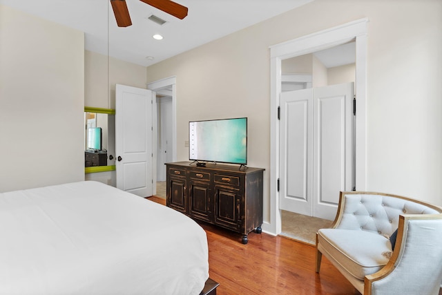 bedroom featuring ceiling fan and light hardwood / wood-style flooring