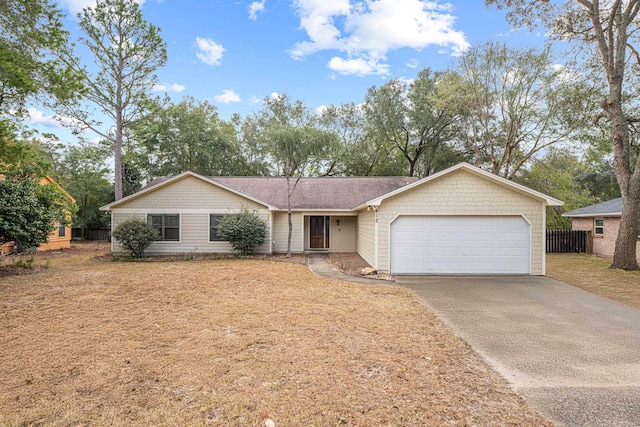 ranch-style home with an attached garage and driveway