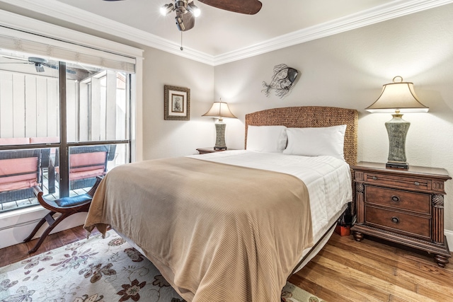 bedroom featuring crown molding, ceiling fan, and hardwood / wood-style flooring