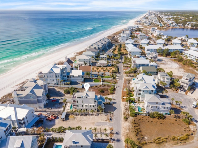 aerial view featuring a view of the beach and a water view