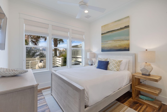 bedroom featuring hardwood / wood-style floors and ceiling fan