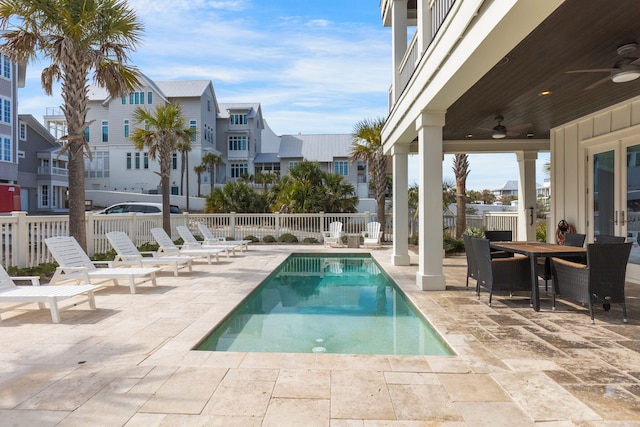 view of swimming pool featuring a patio and ceiling fan