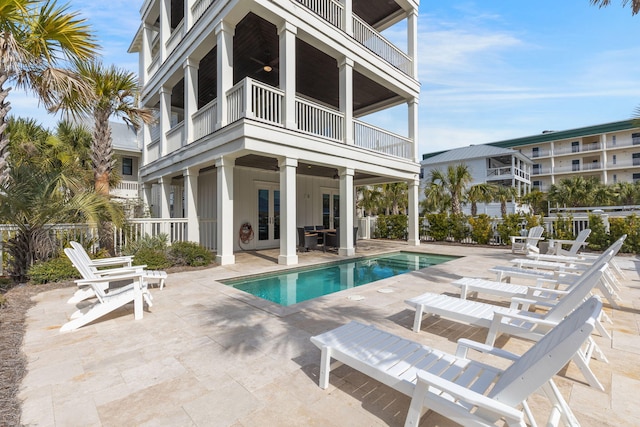 view of pool featuring a patio and ceiling fan