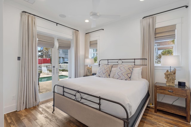 bedroom featuring ceiling fan, hardwood / wood-style floors, and access to outside