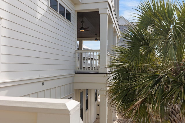 exterior space featuring ceiling fan and a balcony