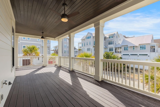 wooden terrace featuring ceiling fan