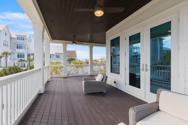 deck with ceiling fan and french doors