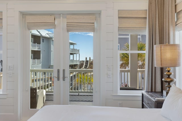 bedroom featuring access to exterior and french doors