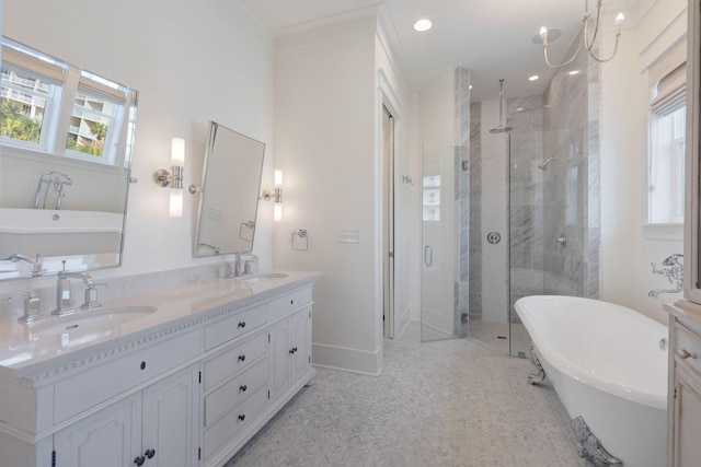 bathroom with tile patterned flooring, plus walk in shower, a wealth of natural light, and vanity