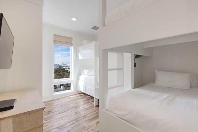 bedroom with light hardwood / wood-style flooring