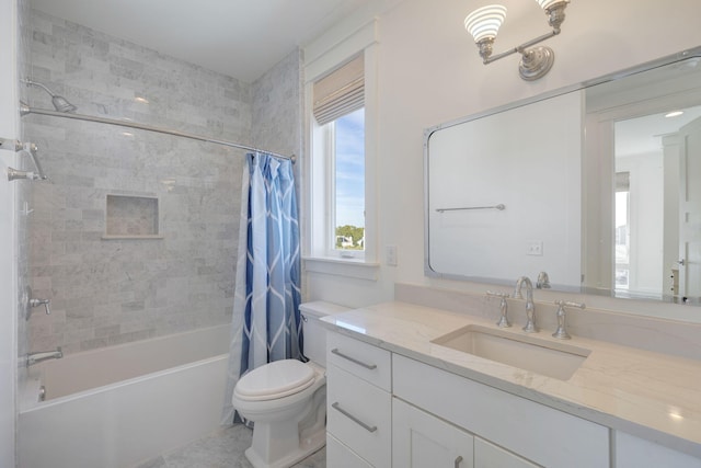 full bathroom with vanity, shower / bath combination with curtain, and toilet