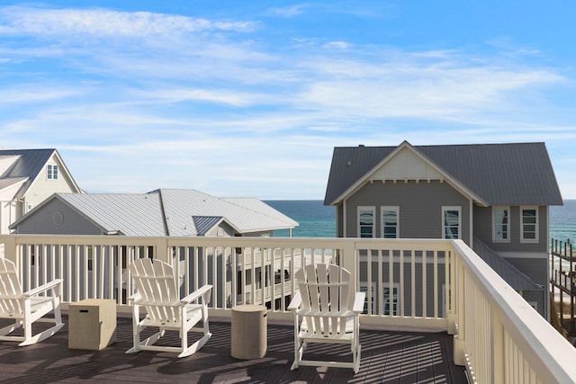 wooden terrace with a water view