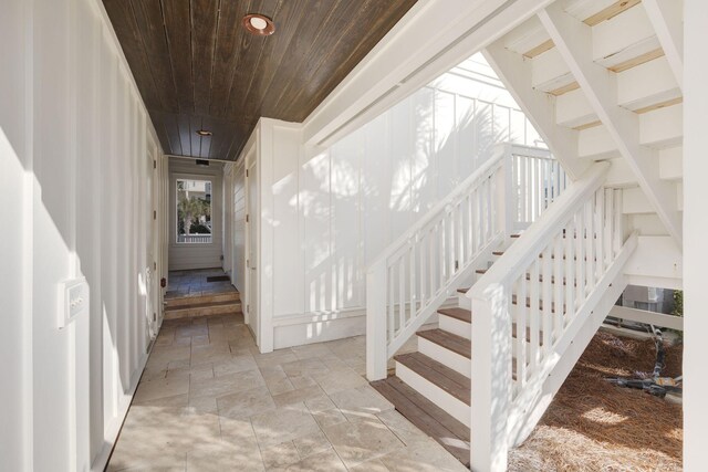 stairs featuring wood ceiling